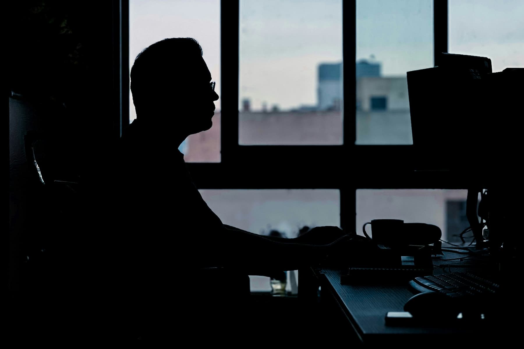 The founder reviewing a client dashboard at a desk